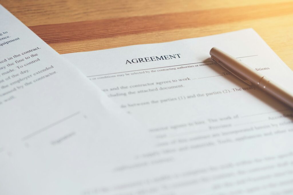 closeup of signing a documentation agreement and pen on the table.