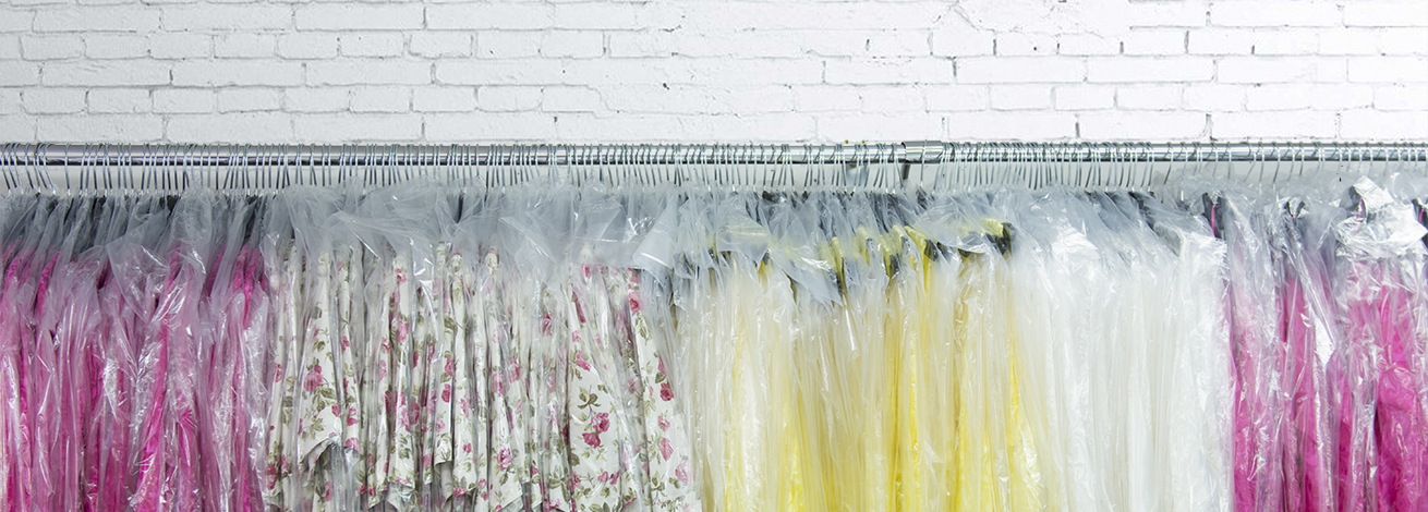 Dress production hanging on a garment rail.